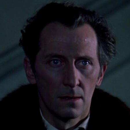 an image of lawrence van helsing. he's a white man with blue eyes and dark, graying auburn hair. he looks disheveled and sweaty.
